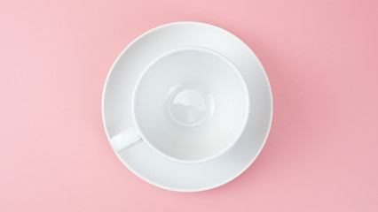 White cup isolated on pink background, Top view Food concept.