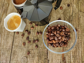 Cup and grain of coffee