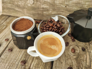 Cup and grain of coffee