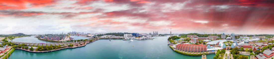 Obraz premium Sentosa Island, Singapore. Panoramic aerial view of cityscape and coastline at sunset