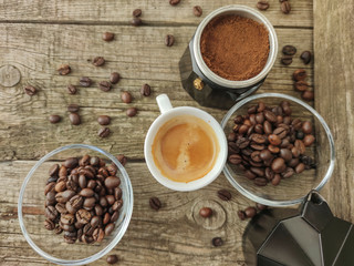 Cup and grain of coffee