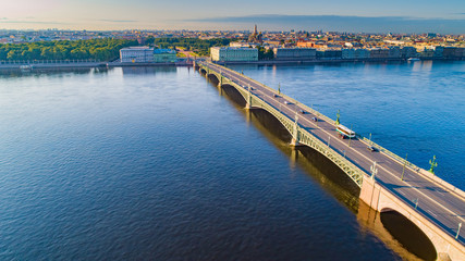 Fototapeta na wymiar Russia. Saint Petersburg from a height. Panorama of the Neva river and Trinity bridge. Rivers Of Petersburg. Bridges Of Petersburg. Trinity bridge over the Neva river on a summer day. Neva embankment.