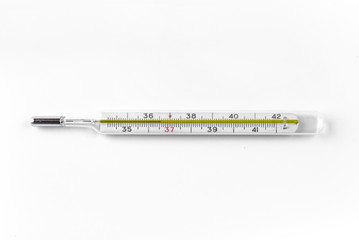 Glass thermometer for measuring body temperature on a white background. Copy space. Empty space for inserting text