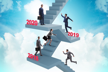 Businessman climbing stairs on yearly basis