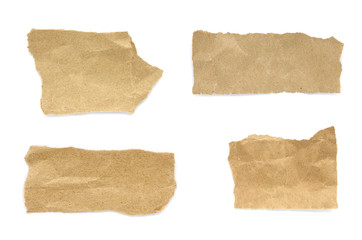 torn paper isolated on white background. Brown paper torn or ripped pieces of paper isolated on white background.
