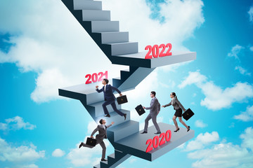 Businessman climbing stairs on yearly basis