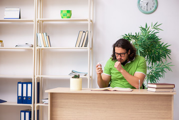 Young man student studying at home in self-isolation concept