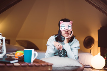 Bored woman hates getting stressed waking up early 7 o'clock on bed,Alarm clock