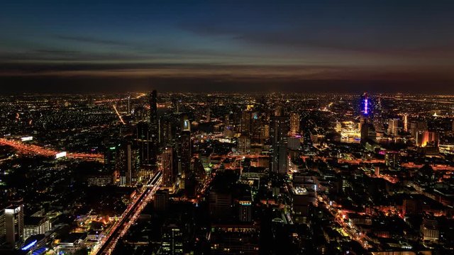 day to night time lapse of Bangkok city downtown and road traffic in Thailand , Cityscape view 