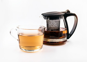 Teapot and cup with tea  on white background