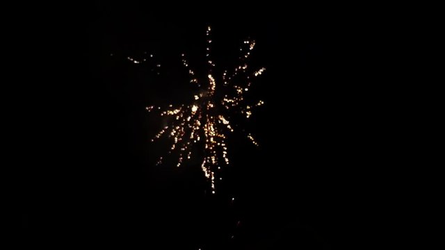 Fireworks display at dark night sky in slow motion Grand Finale blur