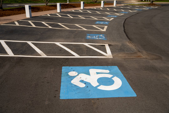 An empty parking lot showing handicap parking spaces
