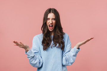 Image of displeased brunette woman screaming and throwing up her arms