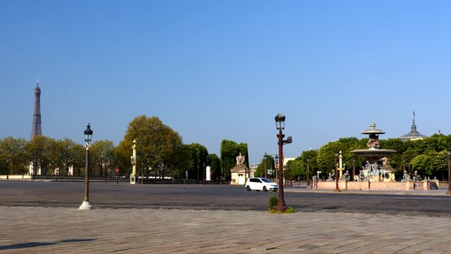 Place de la Concorde Square during Coronavirus Covid-19 lockdown confinement in Paris with Eiffel Tower behind. Static shot with no traffic