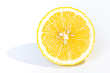 A slice of lemon isolated on white background