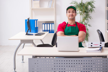 Young male pizza courier in industrial espionage concept