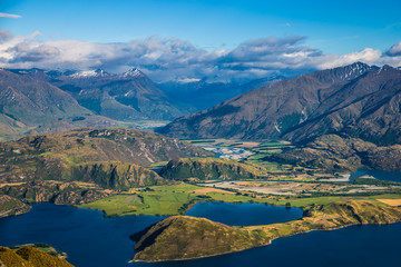 New Zealand landscape background. Roys peak mountain hike in Wanaka New Zealand. Popular tourism travel destination. Hiking travel and adventure. 
