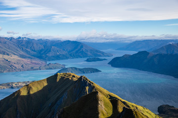 Roys peak mountain hike in Wanaka New Zealand. Popular tourism travel destination. Concept for hiking travel and adventure. New Zealand landscape background.	