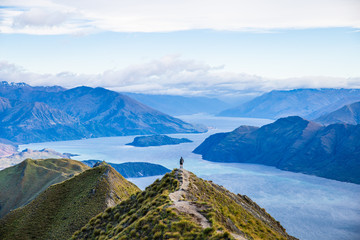 Roys peak mountain hike in Wanaka New Zealand. Popular tourism travel destination. Concept for hiking travel and adventure. New Zealand landscape background.	