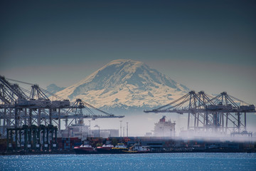 2020-04-18 THE HARBOR ISLAND CRANES AND MT RAINIER IN THE BACKGROUND IN A EARLY MORNING FOG.