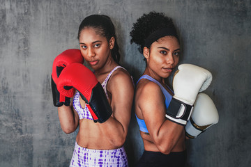 Strong and fit woman boxers
