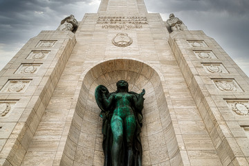 Tower in the National Monument to the Flag of Rosario, Argentina, with stormy sky seen from below