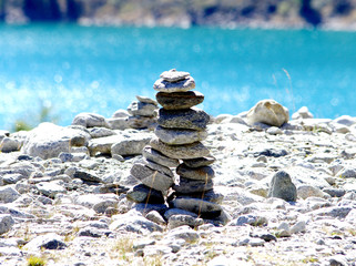 stone pyramids, little man, mound, ovoo, Inukshuk made near the lake or the mountain river