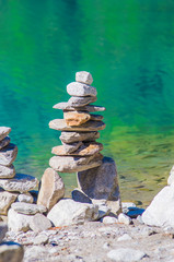 stone pyramids, little man, mound, ovoo, Inukshuk made near the lake or the mountain river