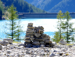 stone pyramids, little man, mound, ovoo, Inukshuk made near the lake or the mountain river