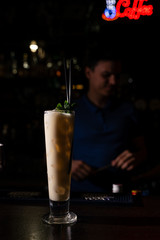 bartender made a creamy alcohol cocktail with mint leaves