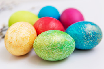 Multi-colored Easter eggs. Easter and religious traditions. Close-up. White background.