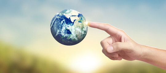 Globe ,earth in hand, holding our planet glowing. Earth image provided by Nasa