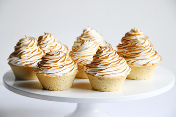 lemon meringue tart closeup on white background. lemon curd tart. tasty lemon mini meringue pie