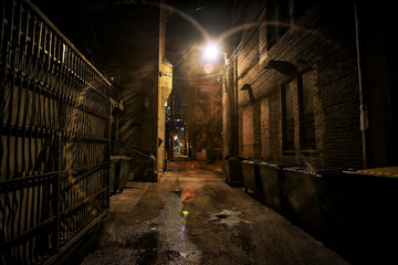 Fototapeta premium Dark and eerie urban city alley at night&nbsp;