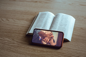 Worship from home, Online live church for sunday service, Top view of mobile screen with close up...
