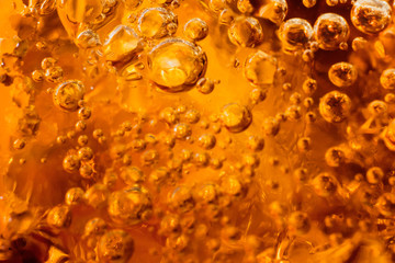 abstract water with  bubbles soars over a golden background