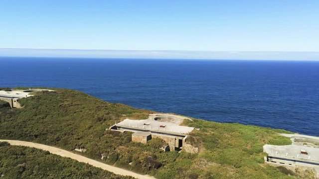 Sweeping aerial panorama of abandoned ruins at Cape Prior located near the chapel of Santa Comba. Galicia, Spain