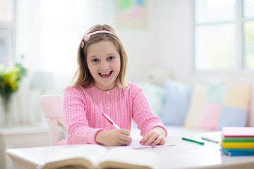 Online remote learning. School kids with computer.