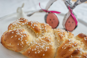 Home made sweet braided bread on a wooden board
