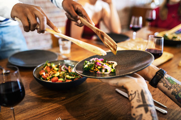 Man serving food to his friends