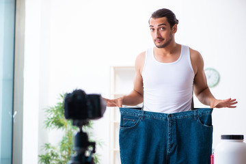 Young male blogger in dieting concept