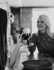 Friends clinking glasses