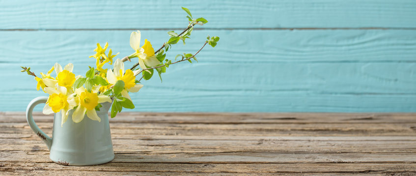 Yellow Spring Flowers On Old Wooden Background