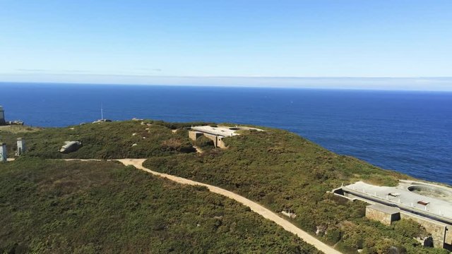 Sweeping aerial panorama of the chapel of Santa Comba, abandoned ruins Cape Prior, Galicia, Spain