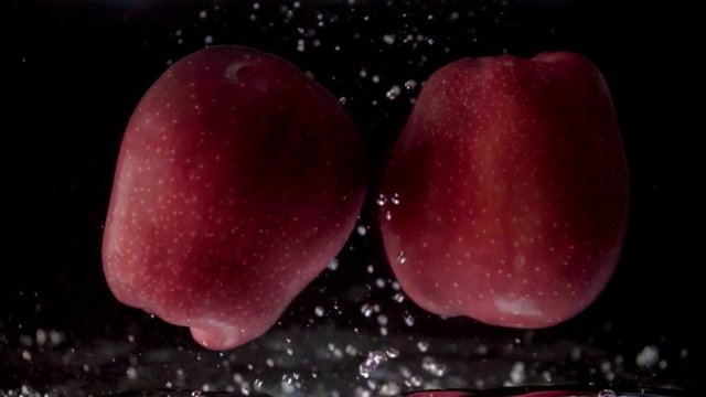 Apples are dipped in water