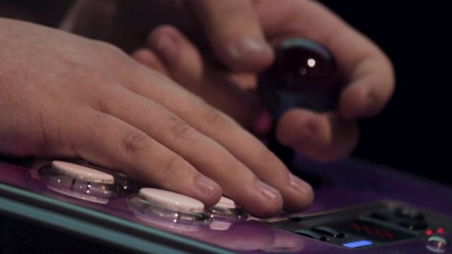Purple gamepad being used during gaming competition, close up