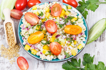 Fresh salad with bulgur groats and vegetables. Healthy lifestyles and nutrition