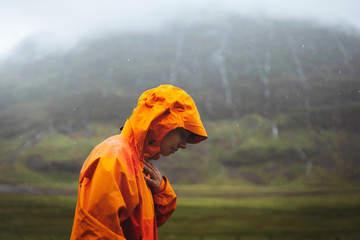 Orange raincoat in the rain