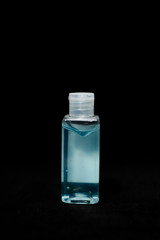 Coronavirus prevention hand sanitizer gel in bottle. Hand disinfectant gel isolated on black background.