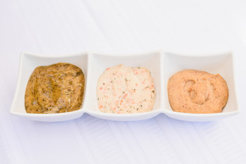 Three option sauce plate on isolated white background, tartar sauce variation, sauce boat on white, season sauces on white table, seasoning collection